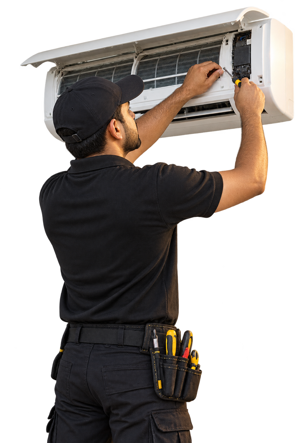 Technician in a dark uniform servicing a wall-mounted air conditioner